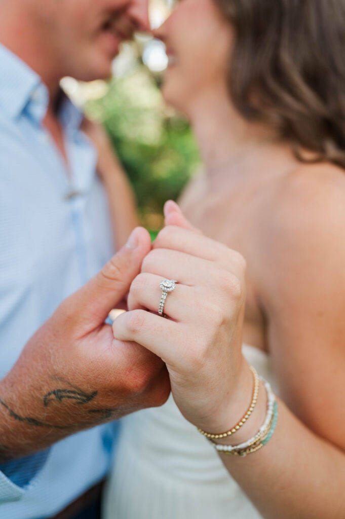 Close-up of an engagement ring during an Eden Gardens engagement session in Santa Rosa Beach, Florida.